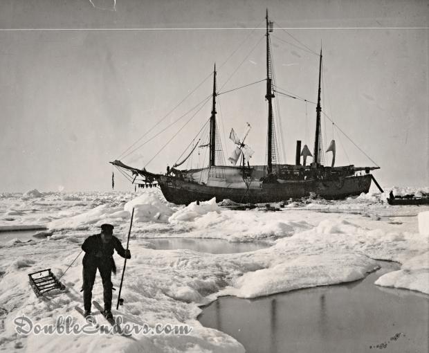 three-masted ship locked in ice with man in the foreground